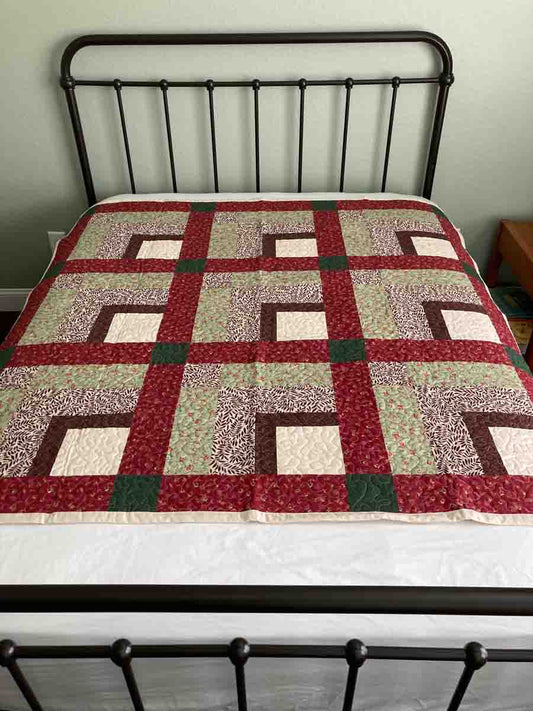 Corner Square Handmade Quilt with red, green, and brown