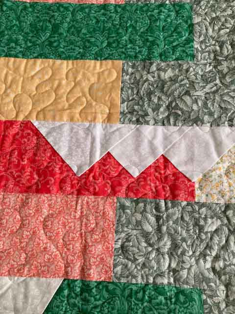 handmade quilt with colorful pocket lapels in red green and yellow