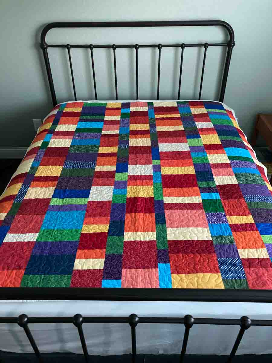 handmade quilt with color stacked blocks