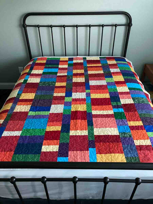 handmade quilt with color stacked blocks