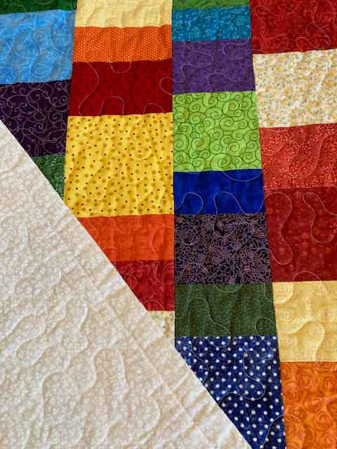 handmade quilt with color stacked blocks